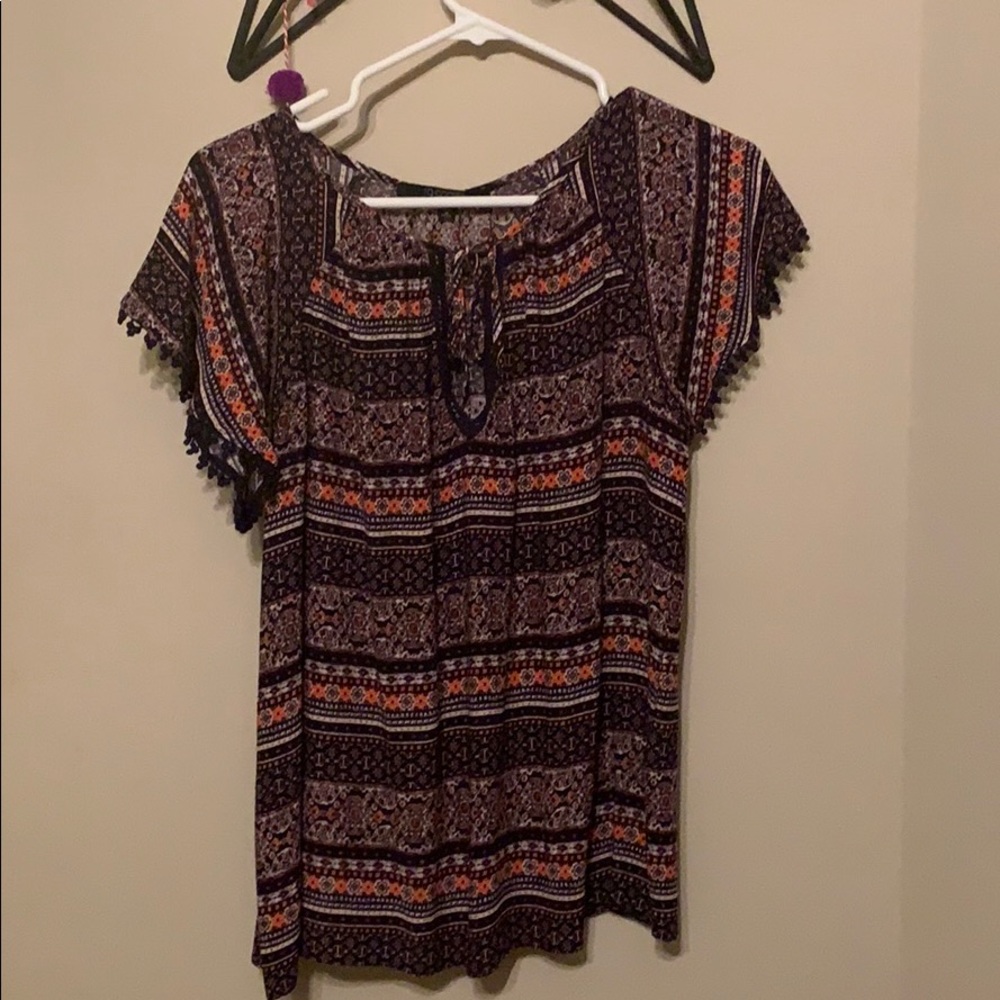 Patterned short sleeved blouse with scoop neck.